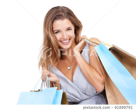 Theres no other way to get your therapy. Studio portrait of an attractive young woman carrying a bunch of shopping bags. Theres no other way to get your therapy. Studio portrait of an attractive young woman carrying a bunch of shopping bags. 92899791
