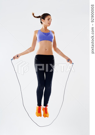 Working up a sweat. Studio shot of an attractive young woman working out. 92900008