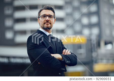 Keeping his ambitions as big as the city. Portrait of a mature businessman standing in the city. Keeping his ambitions as big as the city. Portrait of a mature businessman standing in the city. 92900031