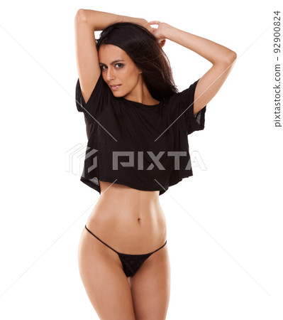 Sensuality is her trademark. A gorgeous young woman expressing herself in her underwear while isolated on white. Sensuality is her trademark. A gorgeous young woman expressing herself in her underwear while isolated on white. 92900824