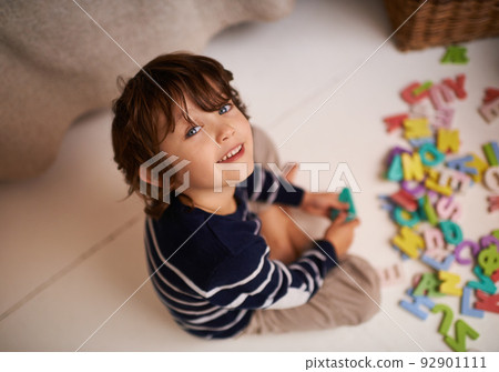 Imagination is the beginning of creation. Portrait of an adorable little boy playing with colorful toy letters. Imagination is the beginning of creation. Portrait of an adorable little boy playing with colorful toy letters. 92901111