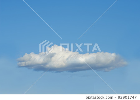 Copy space with a cloud isolated against a clear blue sky on a sunny day outside. One single fluffy and white cloud floating in a peaceful landscape wallpaper and quiet scene for nature background 92901747