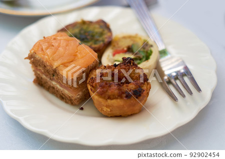Top view of a delicious plate of food on a table during lunch or dinner at home. Healthy and fresh gourmet meal made at a restaurant. Light snacks dished on a plate at an event or party on a counter 92902454