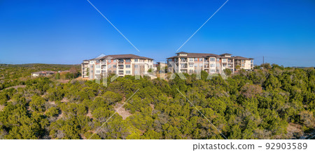 Austin, Texas- Complex apartment buildings near the cliff in a panoramic view 92903589
