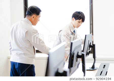 Business scene, computer installer, work clothes 92904194