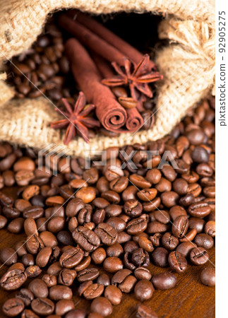 coffee beans, cinnamon sticks and star anise dark background coffee beans, cinnamon sticks and star anise dark background 92905275