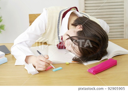 A high school girl who falls asleep while studying at home A high school girl who falls asleep while studying at home 92905905