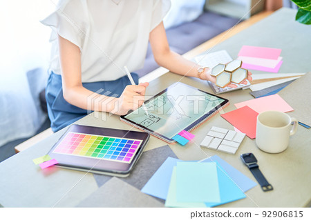 Interior coordinator working in a casual space 92906815