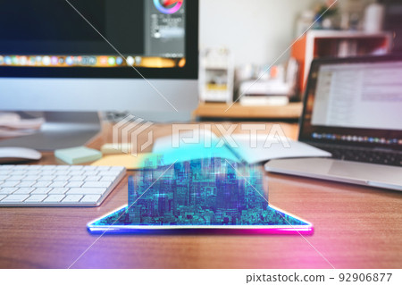 Workplace desk with digital visual hologram neon city and home office background 92906877