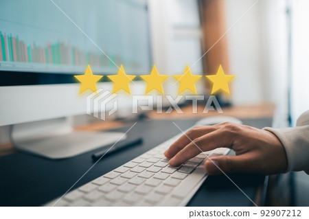 Hand and Phone With Five Star Rating Hand and Phone With Five Star Rating 92907212