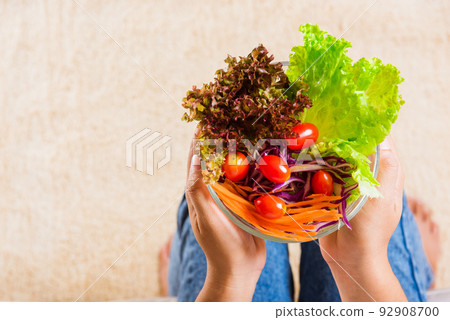 woman eating fresh salad meal vegetarian 92908700