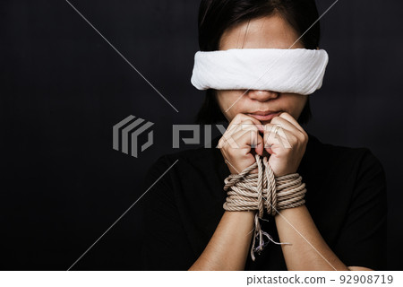 woman tied with chains and closed her eyes woman tied with chains and closed her eyes 92908719