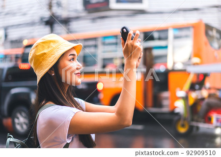Asian traveler woman taking photo with instant camera 92909510