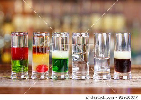 Different cocktails on the bar 92910077