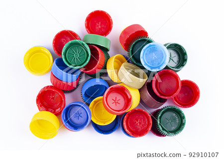 Plastic bottle caps on white background. Cap material is recyclable.  92910107
