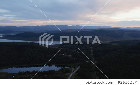 Dramatic sky and lakes in valley of Altai in evening time Dramatic sky and lakes in valley of Altai in evening time 92910217