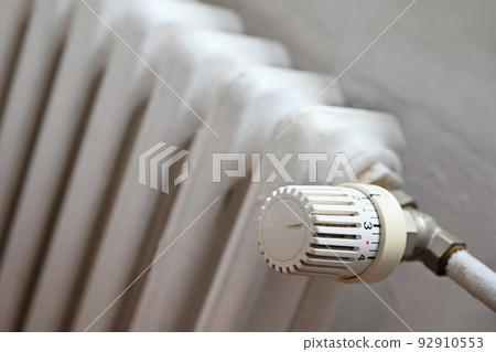 Heating with a tap in the interior of the home. Energy crisis in Europe. The rise in energy prices and the stoppage of gas supplies due to the Russian war in Ukraine. 92910553