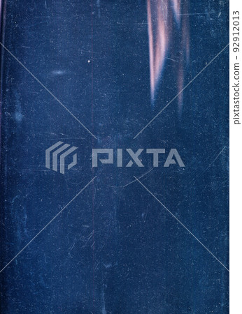 Dust scratches overlay. Distressed texture. Faded screen photo editor filter. Blue grain noise pink color light flare on dark grunge copy space illustration abstract background. 92912013