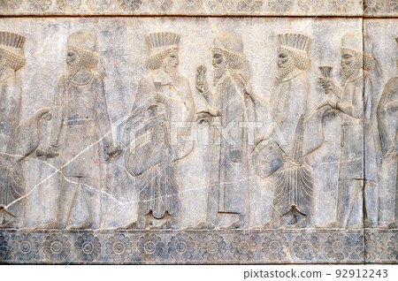 Ancient wall with bas-relief with assyrian foreign ambassadors with gifts and donations, Persepolis, Iran Ancient wall with bas-relief with assyrian foreign ambassadors with gifts and donations, Persepolis, Iran 92912243