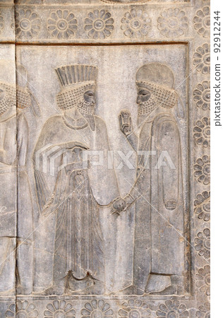 Ancient wall with bas-relief with assyrian foreign ambassadors with gifts and donations, Persepolis, Iran Ancient wall with bas-relief with assyrian foreign ambassadors with gifts and donations, Persepolis, Iran 92912244