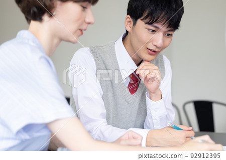 High school student High school student studying with a foreign teacher High school student High school student studying with a foreign teacher 92912395