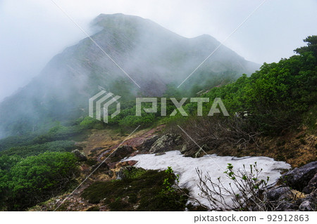 Southern Alps, summer, remaining snow on the road to Mt. Kamikawachidake Southern Alps, summer, remaining snow on the road to Mt. Kamikawachidake 92912863