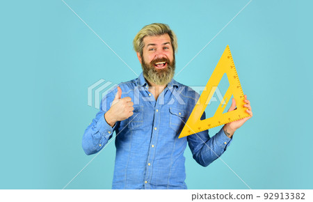 Right angle. Measurement tool. Teacher stem. School education. Find perfect angle. Architect education. Teaching geometry. Bearded man use ruler. Education concept. Drawing lesson. Studying with fun Right angle. Measurement tool. Teacher stem. School education. Find perfect angle. Architect education. Teaching geometry. Bearded man use ruler. Education concept. Drawing lesson. Studying with fun 92913382