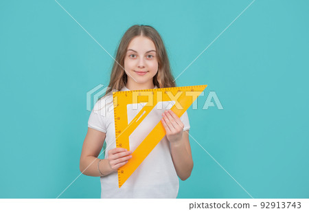 smiling child with math triangle measuring tool smiling child with math triangle measuring tool 92913743