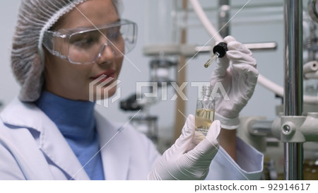 Scientist test CBD hemp oil product in curative CBD lab Scientist test CBD hemp oil product in curative CBD lab 92914617