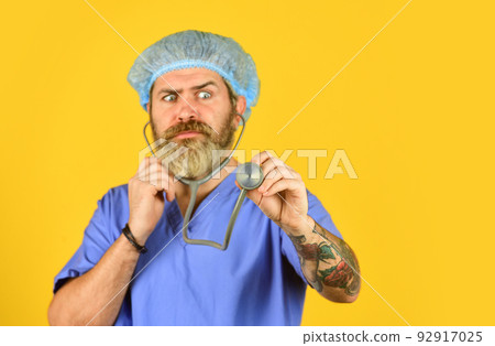 Man doctor with stethoscope physician uniform. Cold and flu remedies. copy space. concentrated doctor use stethoscope. new strain of coronavirus. virus infection from china. testing and treatment 92917025