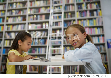 Two teenage girls in the reading room Two teenage girls in the reading room 92917115