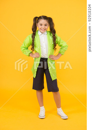 Waterproof concept. Small schoolgirl wear water resistant clothes. Cute schoolgirl feel protected. Happy schoolgirl wear raincoat. Invest in durable kids rainwear to keep children out in fresh air 92918104