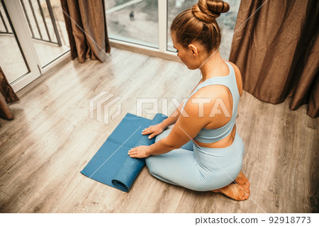 Side View Attractive Young Female Sitting Barefoot Yoga Mat