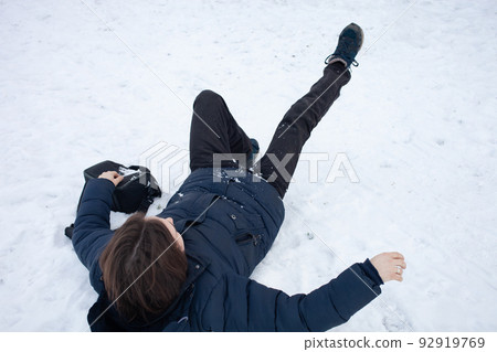 A man falls in the snow. The man slipped and was injured. Falling on slippery ice. Winter. Fracture, bruise, dislocation. A man falls in the snow. The man slipped and was injured. Falling on slippery ice. Winter. Fracture, bruise, dislocation. 92919769