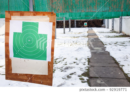 Paper target in the dash hanging. Winter firearms, gunfire on target. sport Paper target in the dash hanging. Winter firearms, gunfire on target. sport 92919771