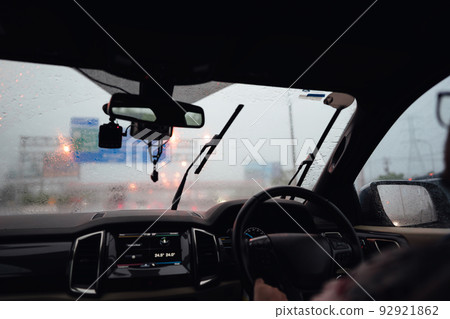 Driving car among heavy rain on day traffic highway slip and wet Driving car among heavy rain on day traffic highway slip and wet 92921862