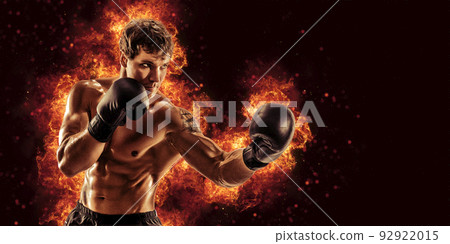 Fighter man punching in fire. MMA fighter 92922015