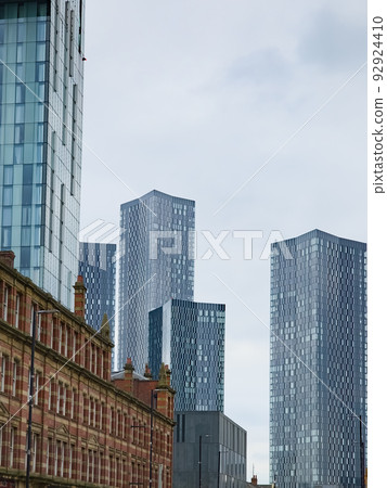 Modern skyscrapers= towers set against classical victorian buildings around Deansgate in Manchester, UK 92924410