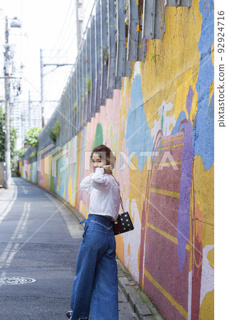 A woman walking A woman walking 92924716