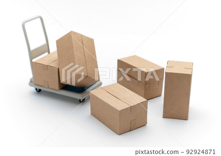 Collapsed luggage, cardboard boxes on a trolley 92924871