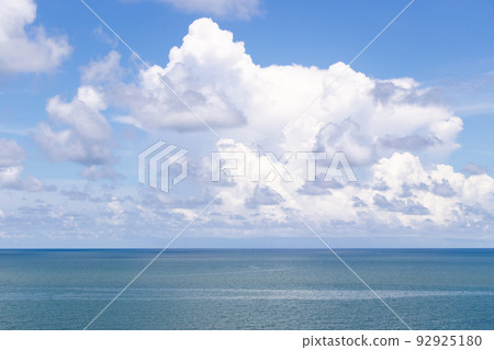 Beautiful calm turquoise color sea and blue sky with white color cloud background Beautiful calm turquoise color sea and blue sky with white color cloud background 92925180