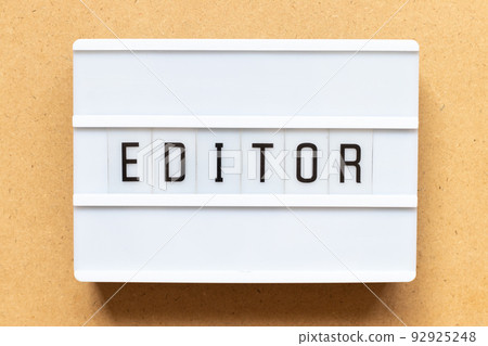Lightbox with word editor on wood background 92925248