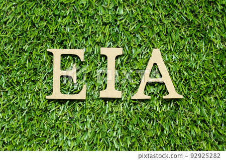 Wood alphabet letter in word EIA (abbreviation of Environmental Impact Assessment) on green grass background Wood alphabet letter in word EIA (abbreviation of Environmental Impact Assessment) on green grass background 92925282