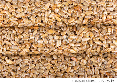 Full frame background and texture of kozinak tile from seeds and molasses. 92926016