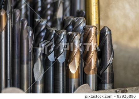 Close-up scene the group of used cutting tools for CNC milling machine. Close-up scene the group of used cutting tools for CNC milling machine. 92926890