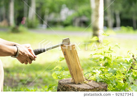 Chopping firewood camping outdoor Chopping firewood camping outdoor 92927341