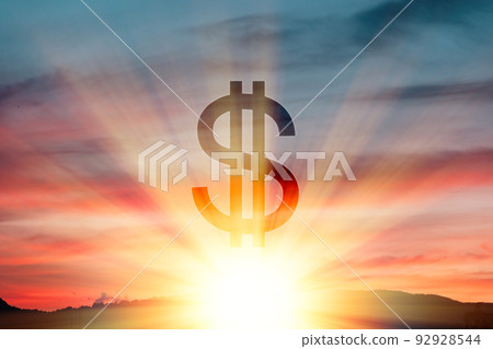 Dollar symbol on the background of a beautiful sunset or sunrise in the sky. Double exposure. The concept of stock trading, market and the crisis Dollar symbol on the background of a beautiful sunset or sunrise in the sky. Double exposure. The concept of stock trading, market and the crisis 92928544
