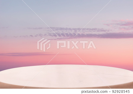 A white marble oval pedestal or table surface on a pink twillight sky background. Copy space. The concept of a product demonstration template 92928545