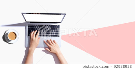 Person using a laptop computer Person using a laptop computer 92928938