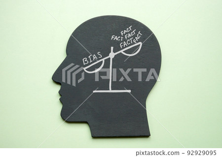 Scales in the head with words bias and facts. 92929095